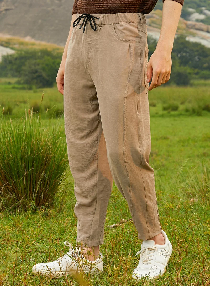CAHOOT  Men's Khaki Beige Solid Tapered Trousers For Casual Wear | Low-Rise | 4 Pockets | Drawstring Closure | Trousers Crafted With Comfort Fit For Everyday Wear for Men | Best Price UAE